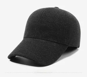Detail of wool blend baseball cap in dark grey with Capard embroidery and curved brim