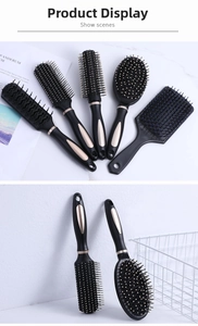 Detailed set of black and gold anti-static hair brushes for professional styling