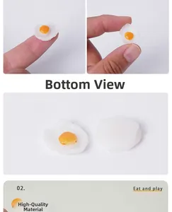 Miniature fried egg PVC model detail showing front and back view with hand scale