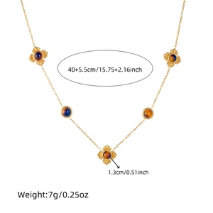 Gold tiger eye flower necklace with blue and amber gemstones on white background