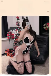 Detailed Christmas lingerie set with contrast bodysuit, fur pom-poms, and lace accessories