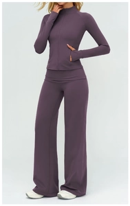 Detail of deep purple yoga set showing high-collar zip jacket and thumbhole cuffs
