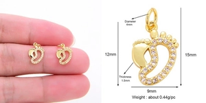 Detail view of gold baby foot pendant with micro-pave zircons and dimensions display