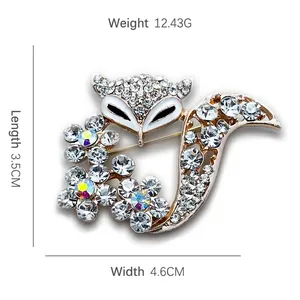 Elegant gold fox brooch with clear cubic zirconia crystals measuring 3.5cm by 4.6cm