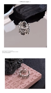 Detail of hollow heart pattern on vintage silver adjustable punk style wide band ring