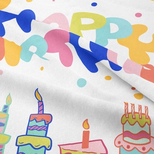 Detail of bohemian birthday wall tapestry showing hand-drawn cake and HAPPY lettering