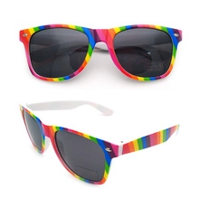 Macro view of kaleidoscope sunglasses with rainbow striped frame and dark tinted lenses