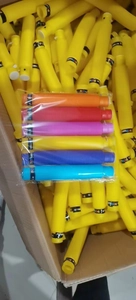 Close-up of 6 multi-colored plastic pop tube sensory toys with printed logo in a package
