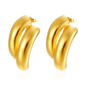 Detailed view of chunky double-tube gold hoop earrings with mirror polished finish