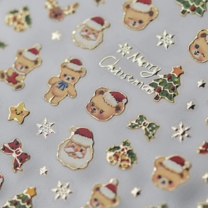 Vue détaillée des autocollants d'ongles de Noël 3D avec ours dorés et icônes de Noël