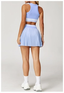 Back view of light blue tennis skirt and tank top set with white stripe details