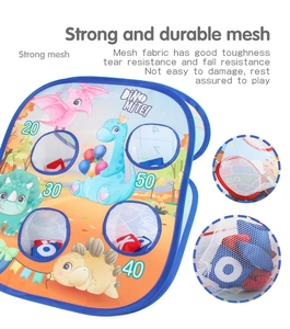 Detail of durable mesh pockets and scoring holes on dinosaur sandbag toss game board