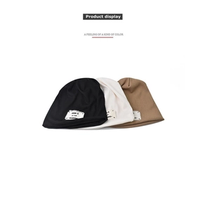 Set of three beanie hats in black, beige, and khaki with vintage alphabet patches