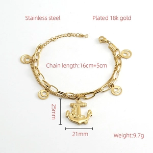 Detail of 18k gold plated anchor pendant on double chain stainless steel bracelet