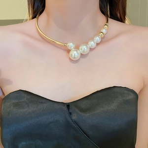 French retro gold metal choker featuring gradient white faux pearls on female model