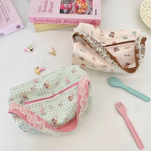Detail of cartoon lace canvas handbags with bunny and bear prints in fresh colors