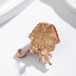 Golden Christmas snowman and cane brooch back view with red enamel and safety pin clasp