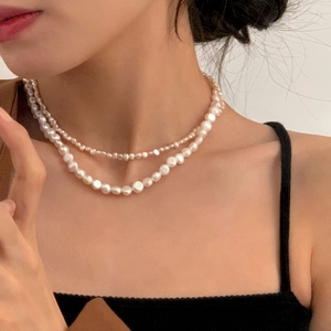 Double-layered natural freshwater pearl necklace featuring small and large pearls in 14K gold