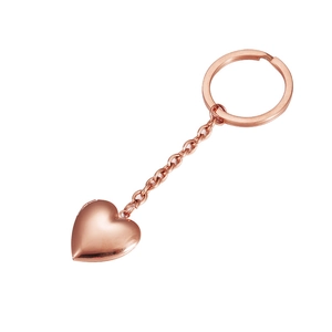 Macro detail of rose gold heart locket keychain with polished finish and opening mechanism
