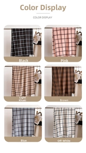 Detail view of plaid scarves in six assorted colors with elegant tassel trim