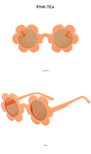 Macro shot of pink flower shaped kids sunglasses with brown lenses from front and side view
