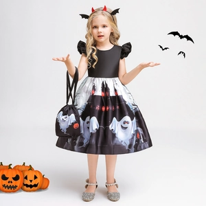 Detail of girls' Halloween witch dress with ghost castle prints and matching bag