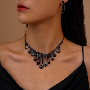 Detail of elegant vintage tassel necklace set with black rhinestones on a model