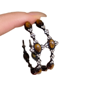 Vintage C-shaped tiger eye hoop earrings with sparkling crystals in black metal finish