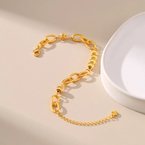 Chunky 18K gold-plated O-chain bracelet with textured spherical beads and lobster clasp