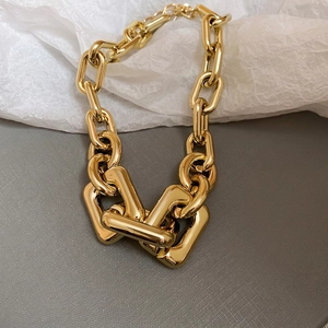 Polished chunky gold link chain necklace in minimalist industrial style for modern women