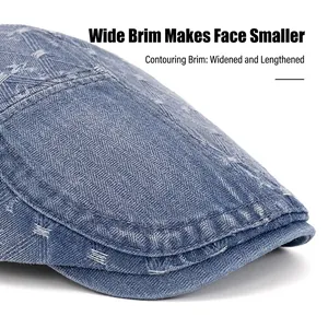 Classic washed blue denim flat cap for men and women featuring white stitching and a wide brim
