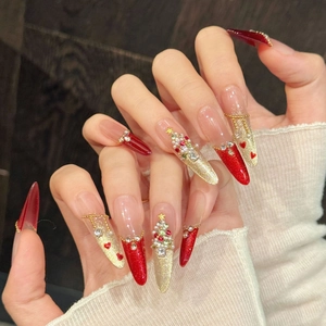 Festive Christmas press-on nails with red cat eye, 3D rhinestone tree, and gold glitter