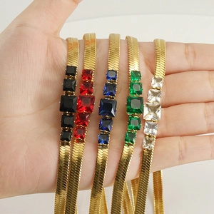 Handheld view of five gold-plated chain bracelets with colorful square gemstones