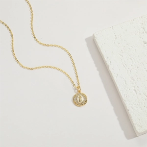 14K gold plated Virgin Mary medallion necklace with sparkling zircon crystals on white stone