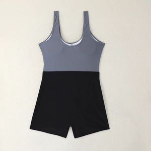 Detailed flat lay of color-block one-piece swimsuit featuring grey and black panels