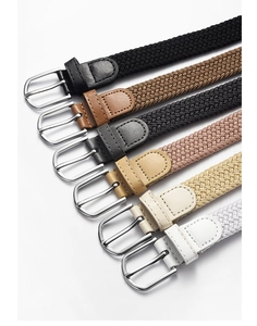Multiple colors of woven elastic belts with leather tips and metal buckles on white background