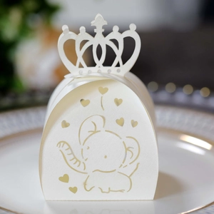 Detailed laser-cut paper gift box featuring elephant and heart patterns with crown handle