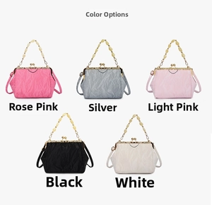 Detailed display of vintage kiss-lock shell bags in pink, silver, black and white colors