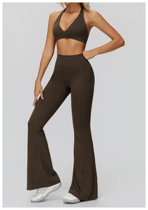 Detail view of dark brown halter sports bra and high-waisted flared yoga pants