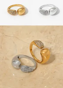 Detailed macro view of open rings featuring pavé set crystals and high hand polishing
