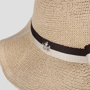 Women's elegant wavy edge summer knit sun hat with floral metal buckle and ribbon detail