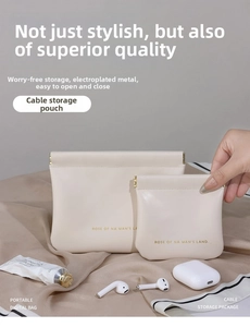 Detail view of cream-colored PU leather pouch showing flexible metal spring closure
