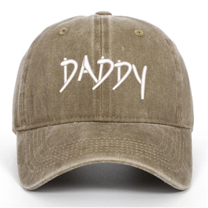 Close-up of DADDY embroidery on vintage washed cotton baseball cap with curved brim