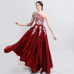 Elegant dark red one-shoulder evening gown with white floral lace embroidery and satin skirt