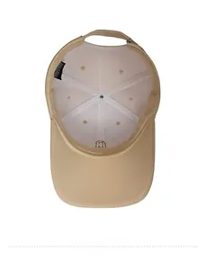 Close-up of beige baseball cap interior showing sweatband and adjustable back strap