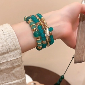 Four-piece multilayer crystal beaded bracelet set with green agate beads and golden accents