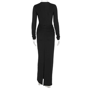 Detail view of the back ruched design and high slit on this sleek black maxi dress