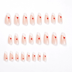 French tip press-on nails with red heart accents on translucent pink base set