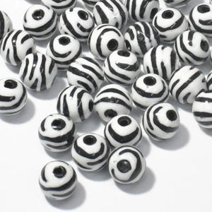 Close-up of zebra pattern acrylic loose beads for DIY jewelry and crafts making