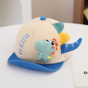 Detail of baby sun hat with 3D green dinosaur patch and breathable mesh back